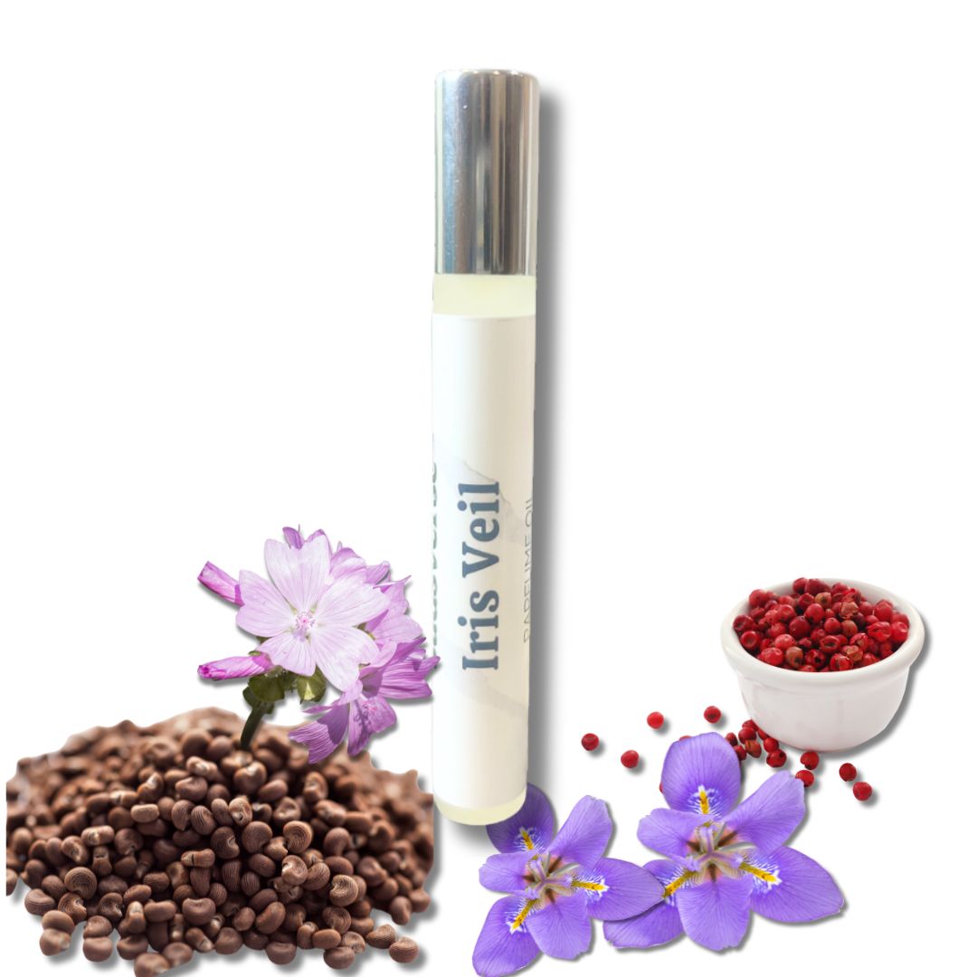 Rollerball Perfume Oil Glossier You 'Iris Veil' surrounded by musk, iris and peppercorn seeds on a white background