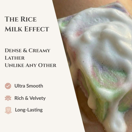 Close-up of a creamy lather with text highlighting 'The Rice Milk Effect' on a light background.