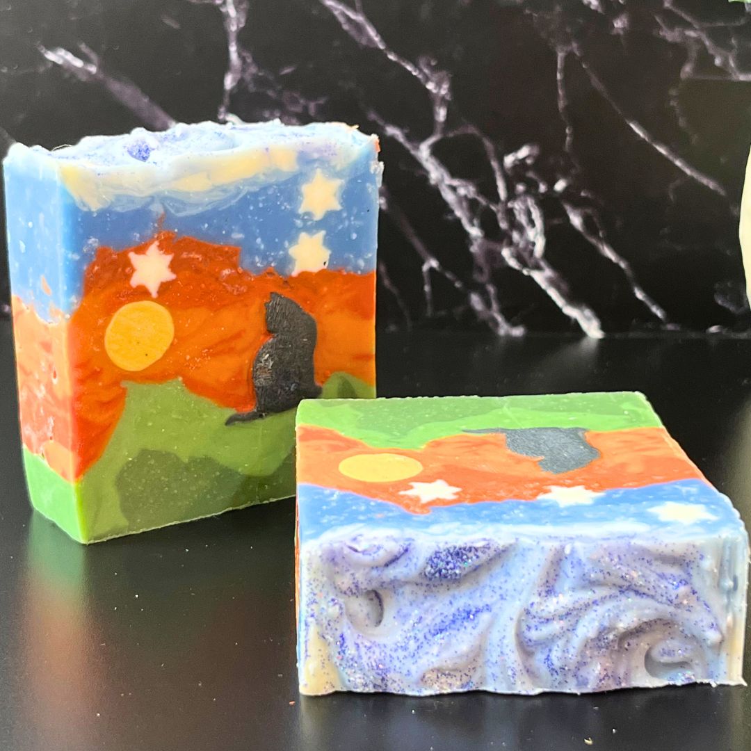 Handmade Celestial Nightscape soap bars featuring black cat silhouette against orange sky with moon and stars