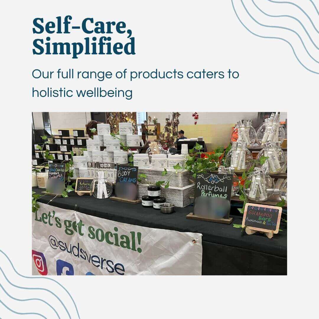 Sudsverse full range of holistic wellbeing products displayed on a vending table