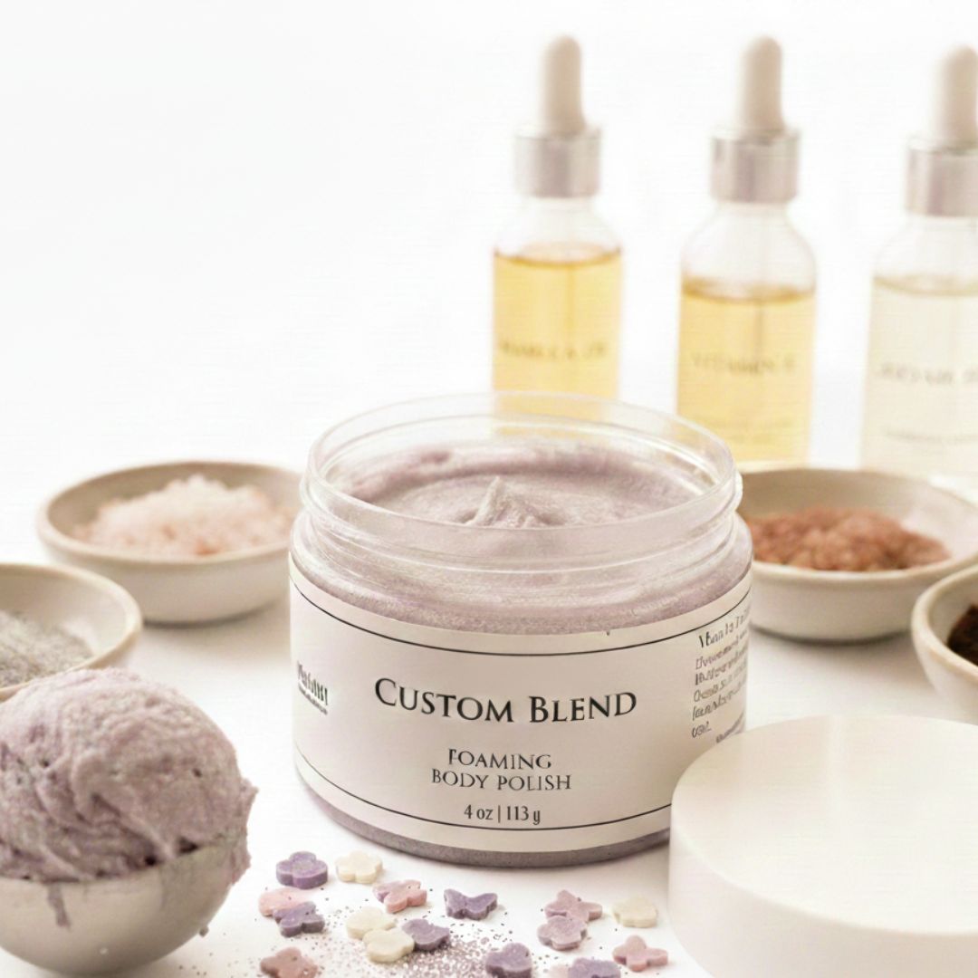 Custom Blend foaming body polish jar with bottles and bowls in the background on a white surface