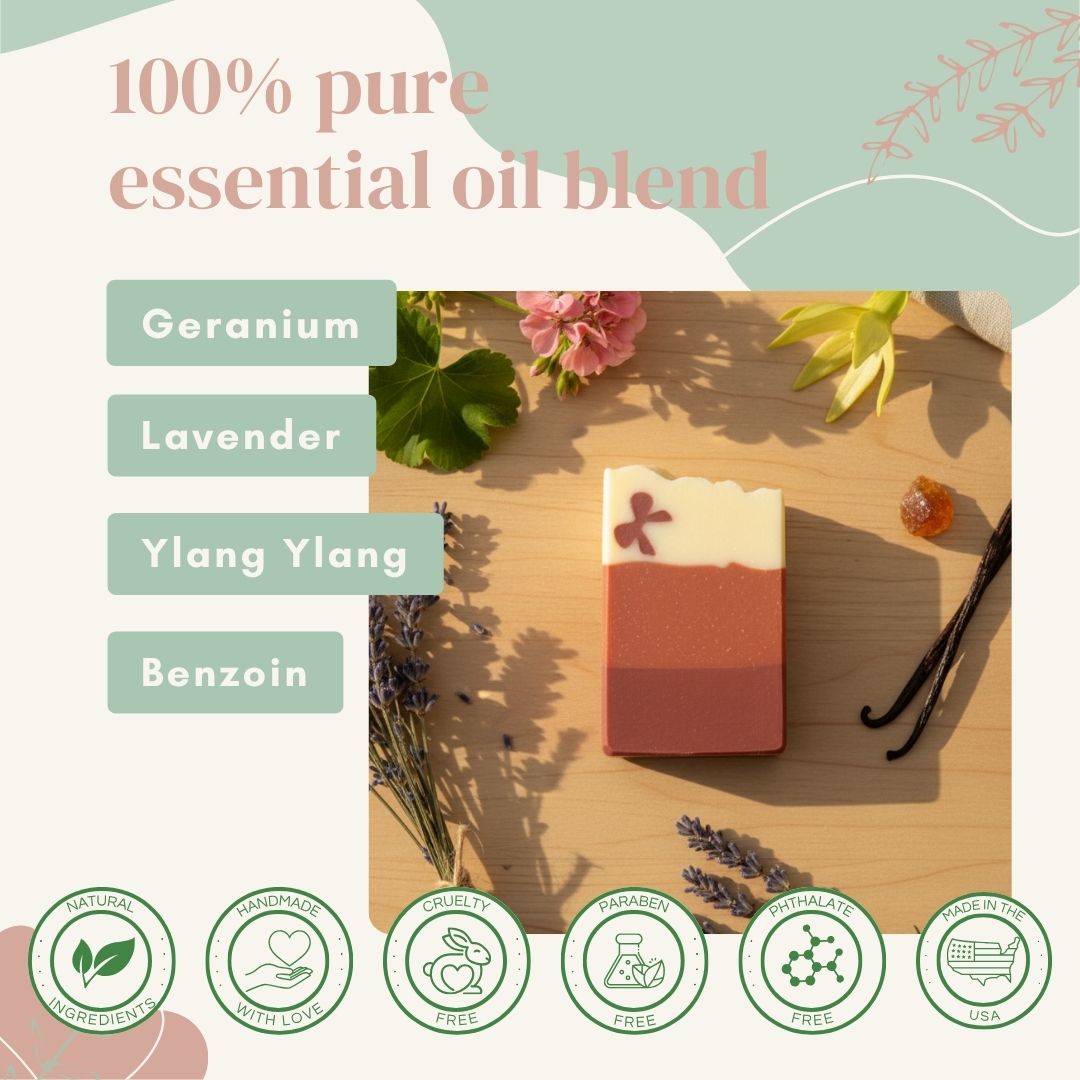 sudsverse rose clay soap bar with essential oil blend on a wooden surface, surrounded by flowers and leaves.