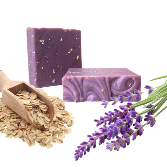 Sudsverse Lavender & Oatmeal Natural Handmade Soap bars with oats and lavender sprigs on white background