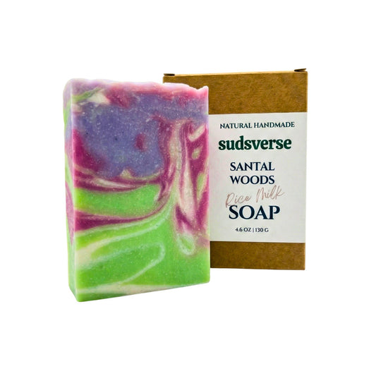 Colorful soap bar with a brown box labeled 'sudsverse Santal Woods' on a white background